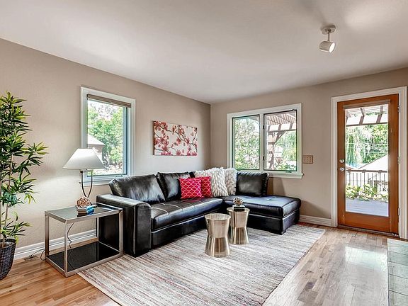 Living room with door to the beautiful deck and Mt. Sanitas views!