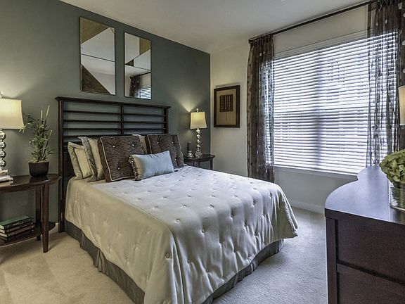 Plush carpeting with padding in bedrooms along with 2' plantation blinds