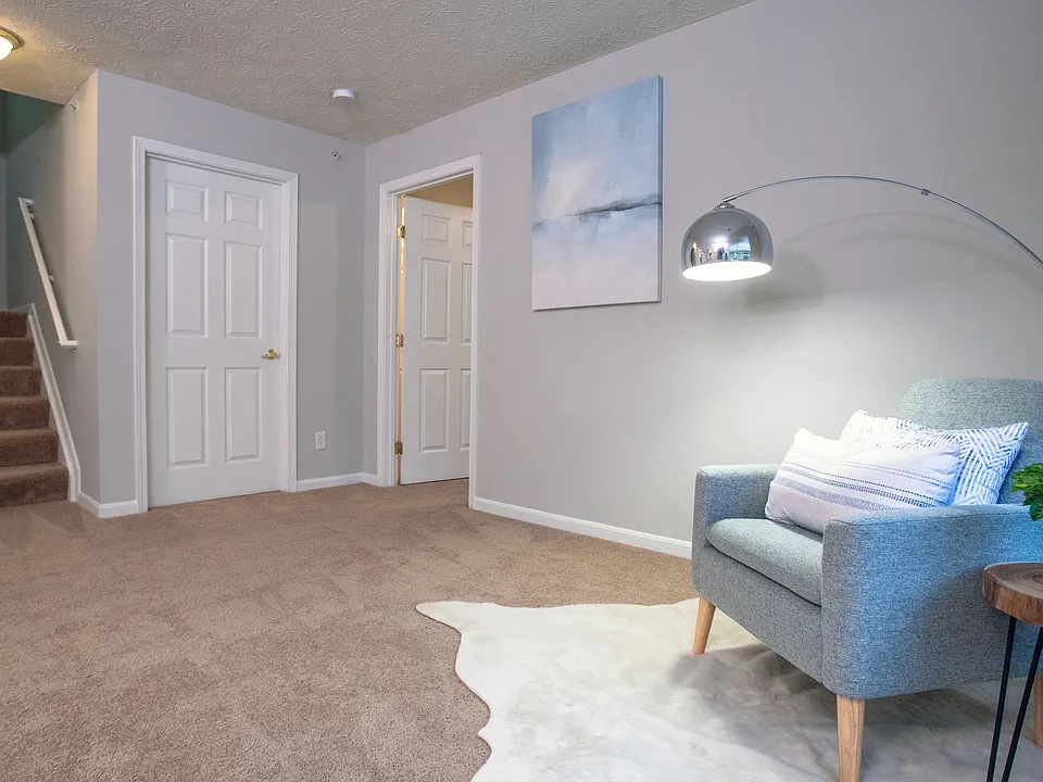 Revel in generously-sized living rooms with plush carpeting.