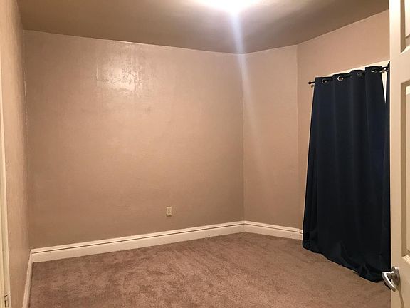 Bedroom with a newer carpet.