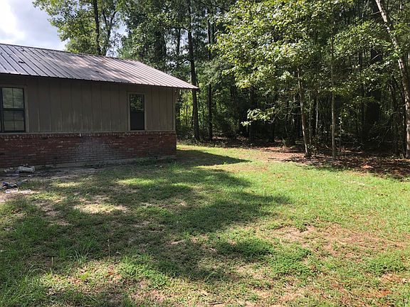 Next to a wooded lot .