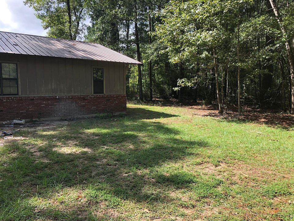 Next to a wooded lot .