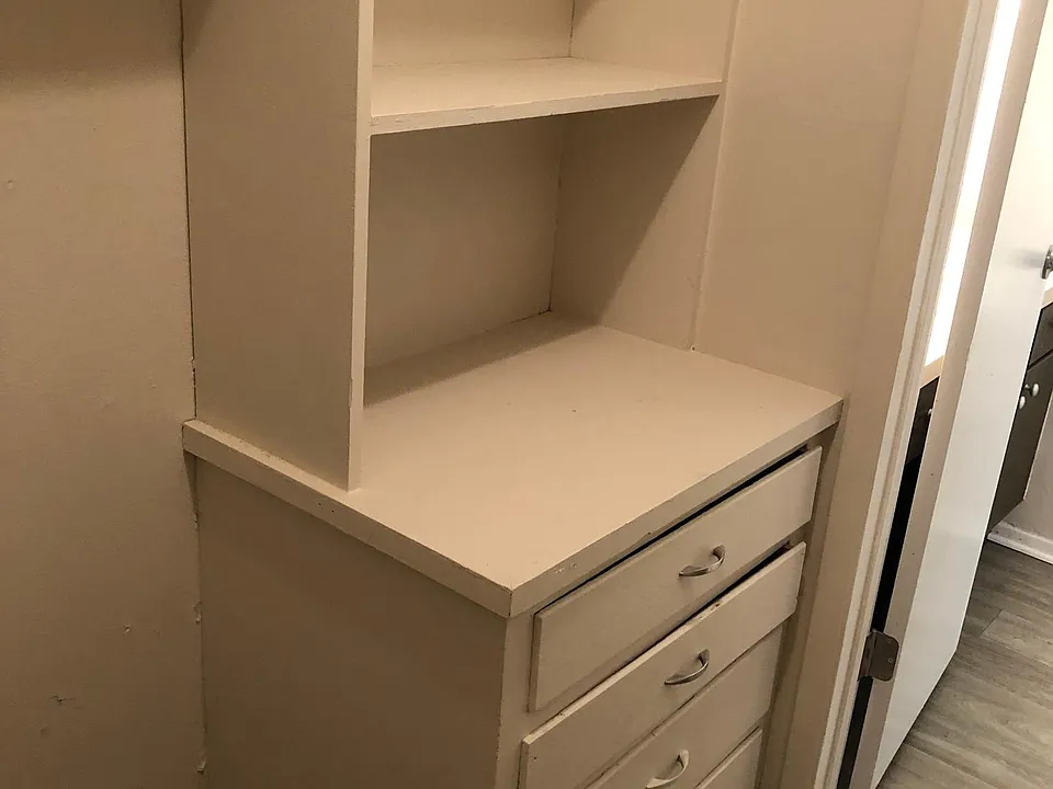 Walk in closet with built in dresser