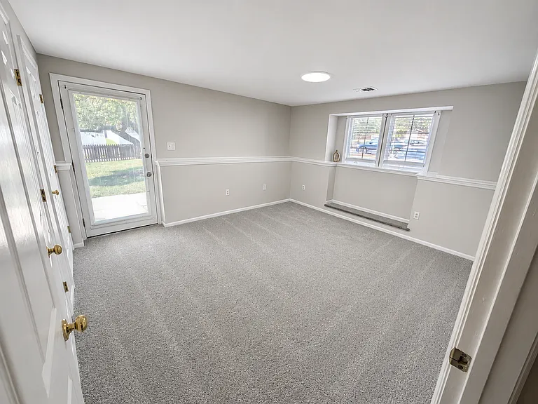 Primary bedroom with walk-in closet, private full bath, and separate entrance