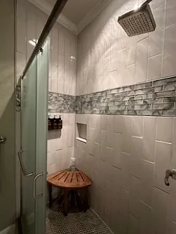 Large walk-in shower is all tile.