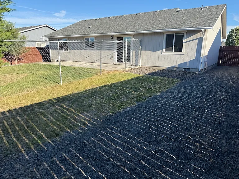 Large backyard, featuring a separately fully-fenced dog run area. Great for renters with pets!