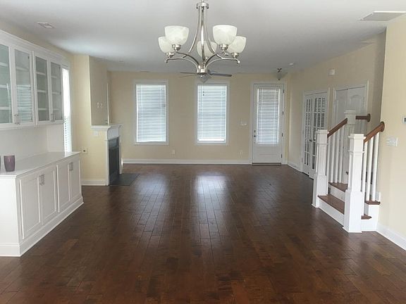 Spacious living room/ hard wood floor