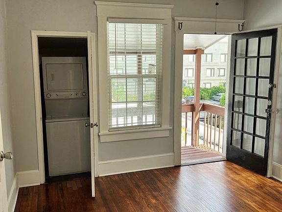 Bedroom with in unit washer/ dryer and private deck