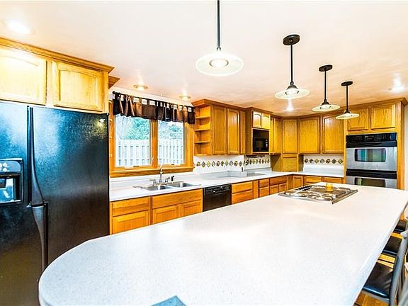 Large eat in kitchen with plenty of countertop space and a double oven for preparing all the fixings for a holiday feast or birt