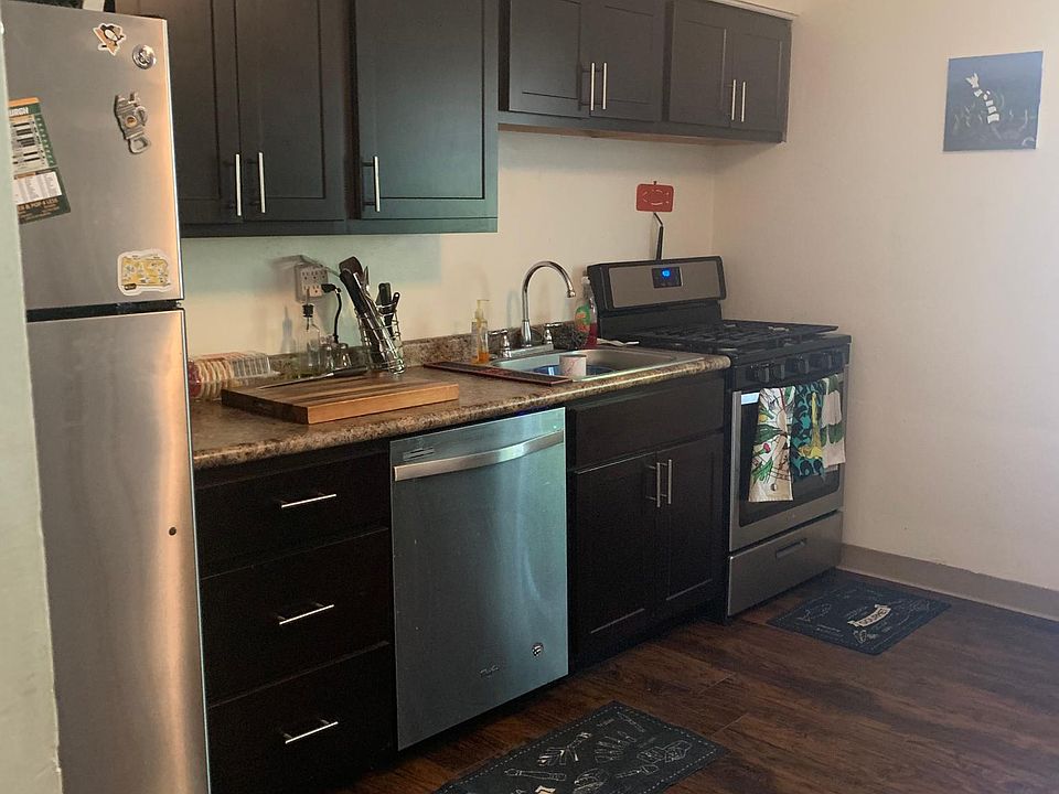 Kitchen - includes dishwasher, gas range, and refrigerator
