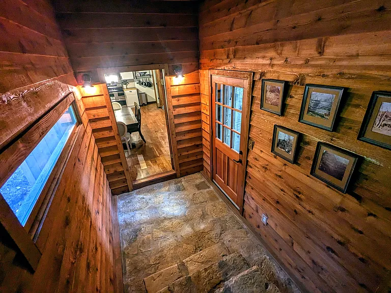 Foyer with Additional Exterior Entry Connecting Main House to Rustic Cabin-Style Game Room