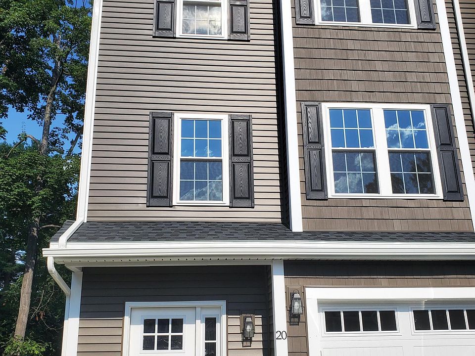 Front View of Townhome. Entrance and Garage