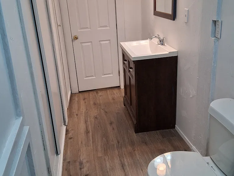 view from opposite side door of bathroom