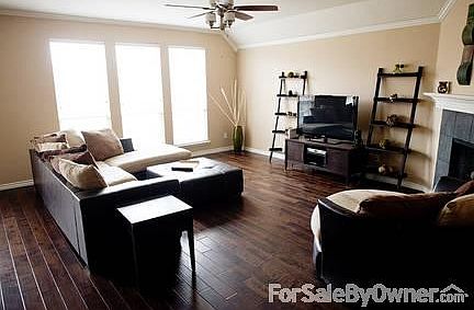 Living Room
						:
						Large open living room with hand-scraped hardwood floors and gas fireplace.