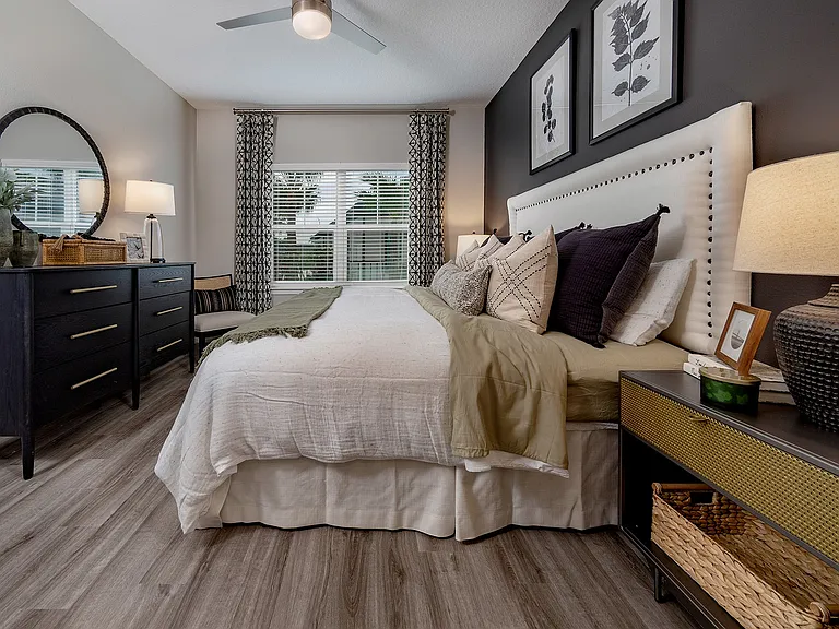 Large Primary Bedroom with Hardwood Style Flooring