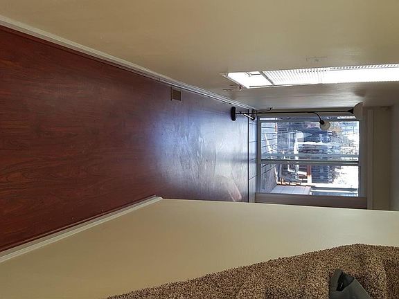 Hallway from front door to living room and kitchen