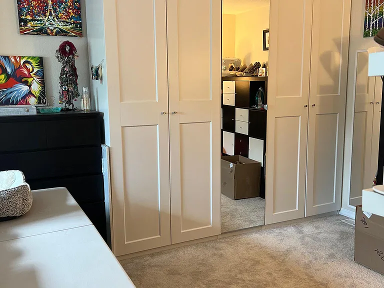 Loft with current tenant set up. Built in closet will remain (5 closet doors including the 1 full length mirror)