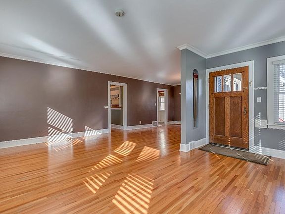 Large, open living room and dining area. Hardwood runs throughout the main-floor.