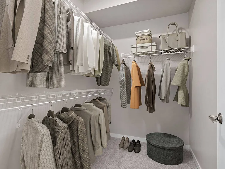 Walk-in closet with ample storage space and great lighting at The Hallon Luxury Apartments in Hopkins MN