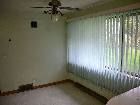 Off to one side of the home is the eating area.  It is open to the kitchen and has a large window overlooking the front yard.