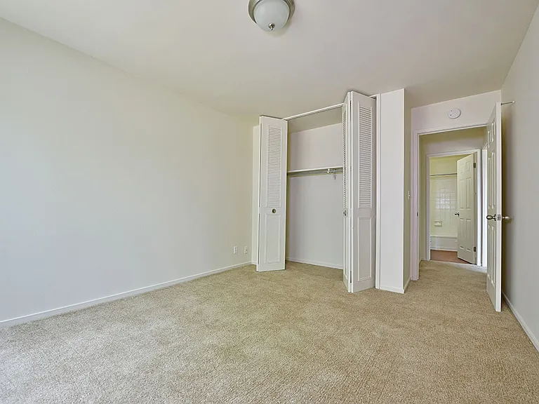 A bedroom at Grand Bend Club Apartments.