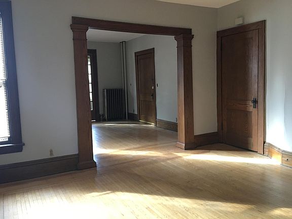 New neutral paint colors in progress throughout! Photo of dining room looking into living room.