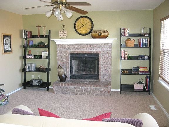 Main level family room with all new carpet and gas fireplace. 