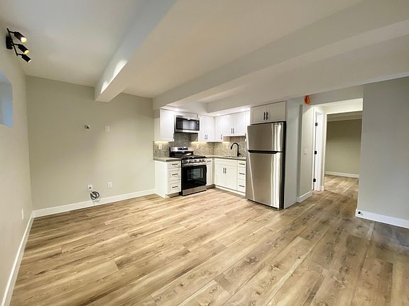 Walk in to an open concept living room and kitchen.