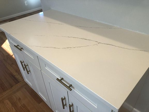 Kitchen w quartz countertops.