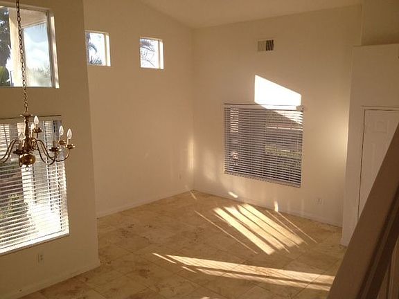 Great room/family room - travertine tile