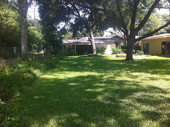 Large backyard with storage and potting shed on far end. Separate sliding glass doors for one of the