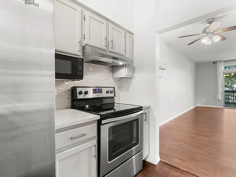 Kitchen opens directly to the main living area, creating an efficient layout for everyday living and entertaining.