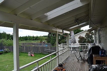 large covered rear deck with skylights