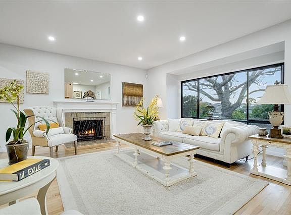 Living room with mature landscaping and park view