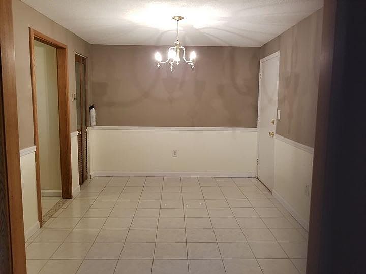 Tiled dining room with closet