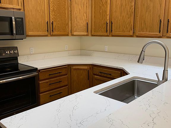 Kitchen with new solid surface countertops