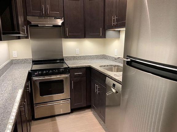 Renovated galley kitchen with dishwasher and stainless steel appliances!