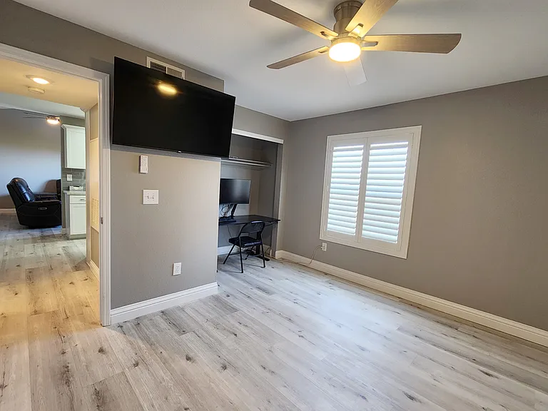 Primary bedroom with flat screen TV