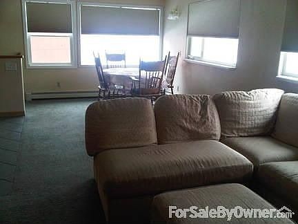 Upstairs living room
						:
						This is a large living area, very open. Lots of windows. Great for large groups.