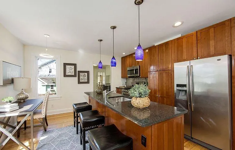 kitchen , granite counters , custom cabinets and island pendants