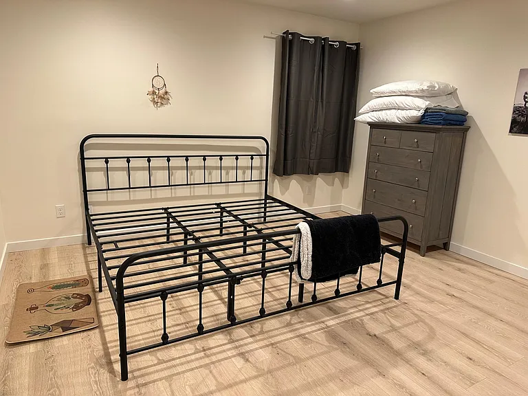 Available bedroom, king size bed, large dresser with all the linens. Black our curtains on both large windows.