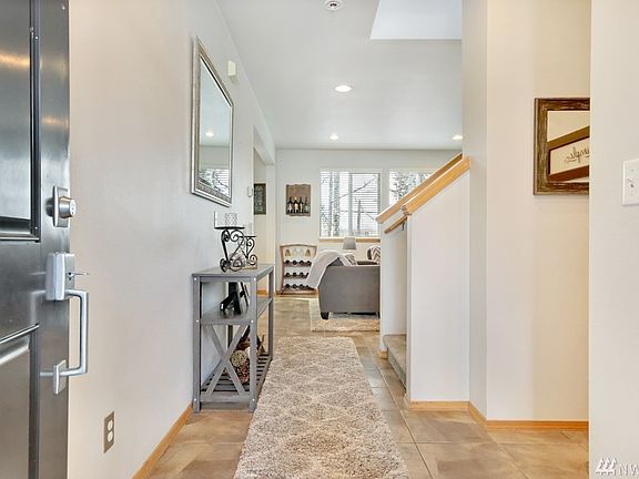 Entry features tile flooring.