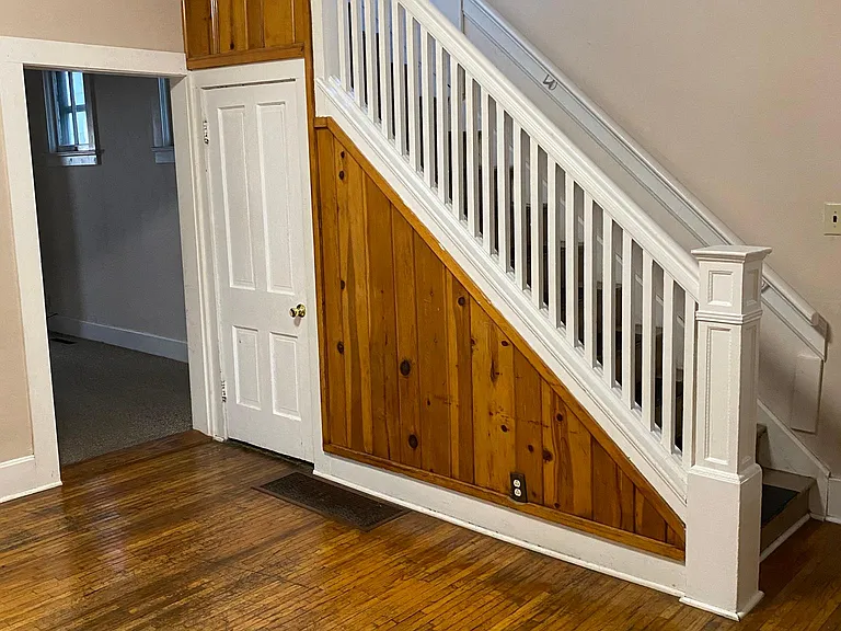 Dining room with open stairway to upper level.