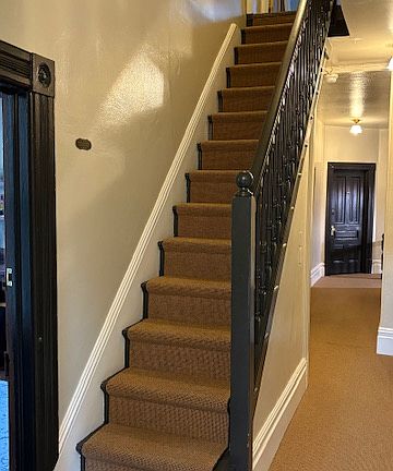 Hall second staircase and laundry location.