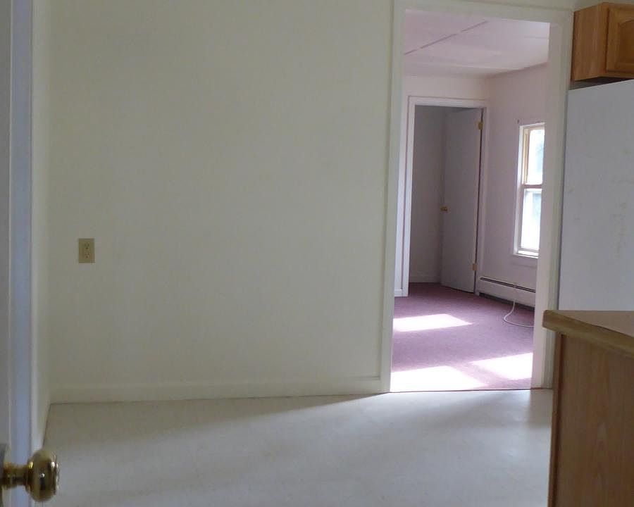 Old photo. Kitchen and living room, new paint, new floors.