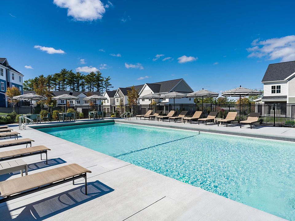 Take a dip or lounge poolside_this expansive outdoor pool offers plenty of space to unwind under the sun.