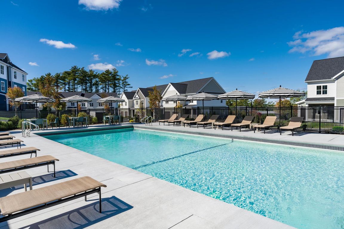 Take a dip or lounge poolside_this expansive outdoor pool offers plenty of space to unwind under the sun.