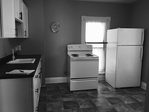 Recently updated kitchen withwhite cabinets, new flooring and paint.