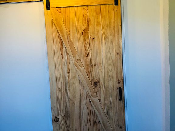 Barn door entry into laundry