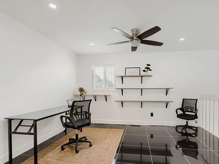 Designated shared workspace with large desk and plenty of space to spread out